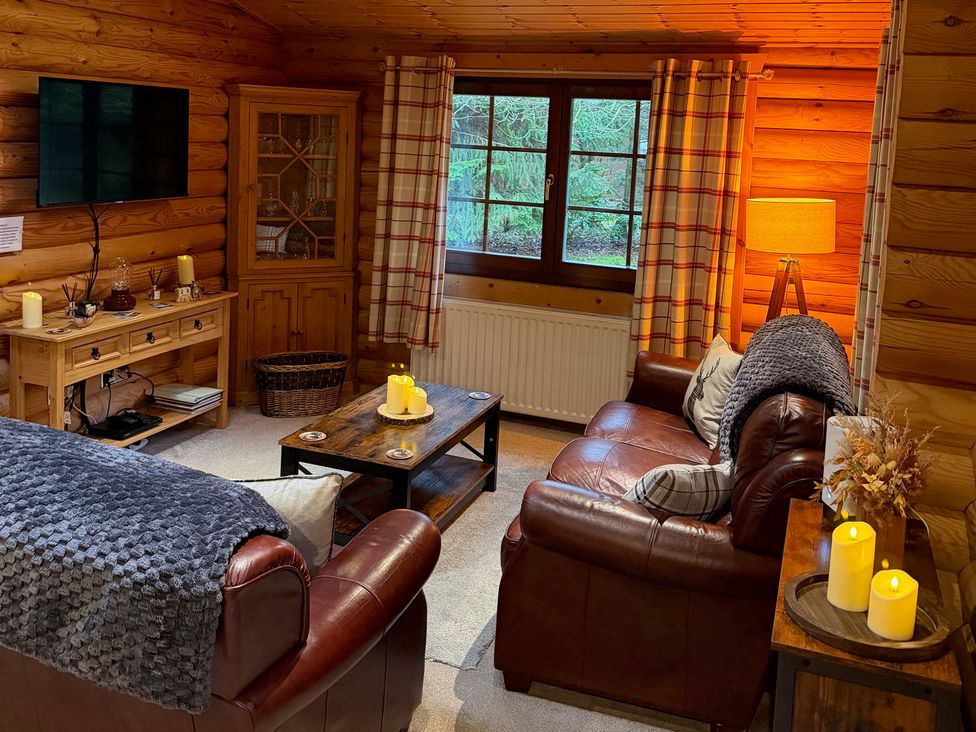 A living room with a sofa and coffee table at Little Bears Hideaway @ 23 Lakeside Felmoor Park near Felton