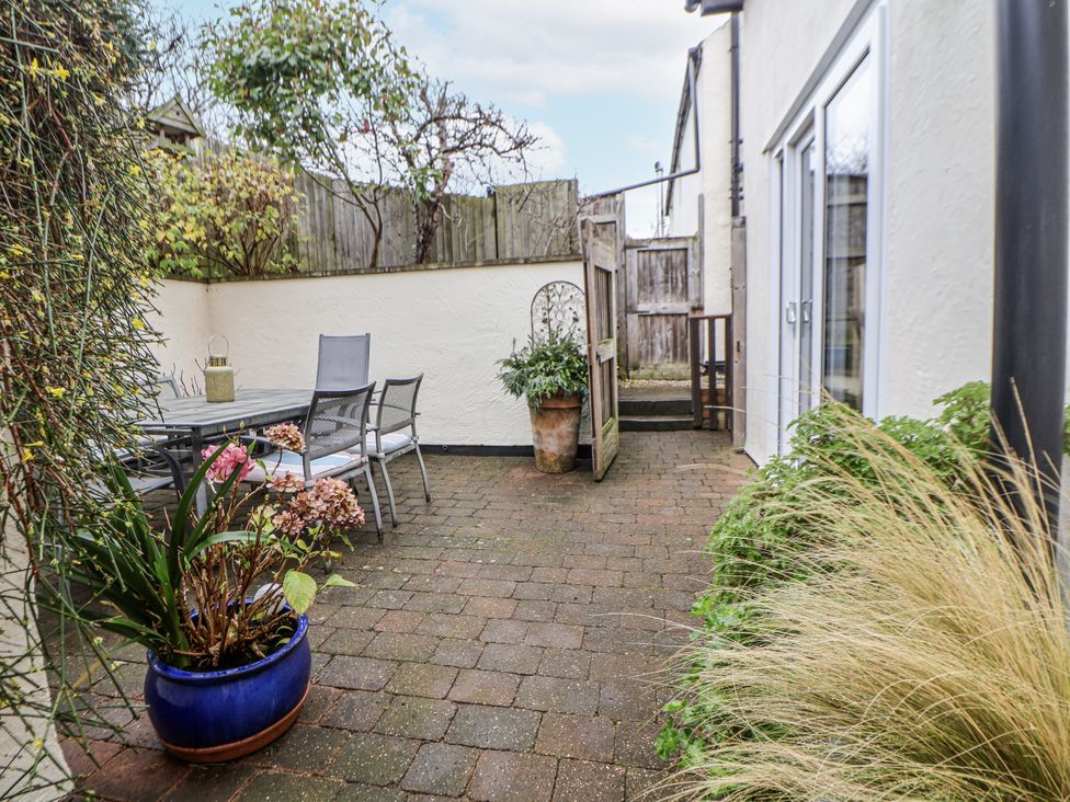 An outdoor area with a table and chairs at The Stables in Prestatyn