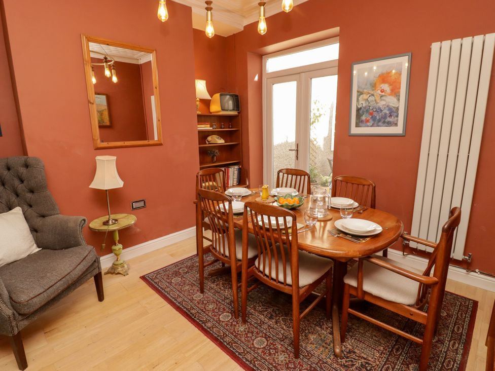 A dining room with a table and chairs at 18 Kent Street Cardiff
