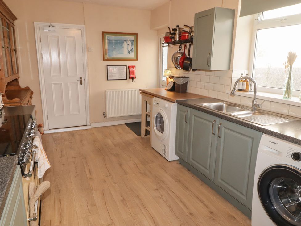 A kitchen with appliances and a countertop at 18 Kent Street Cardiff