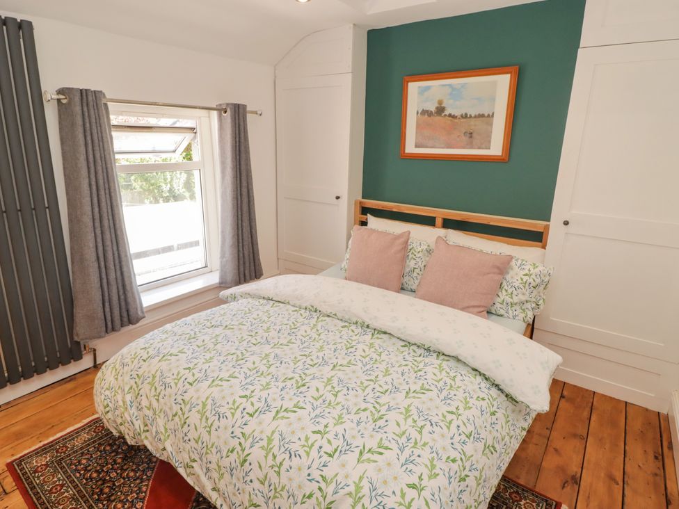 A bedroom with bed and window at 18 Kent Street Cardiff
