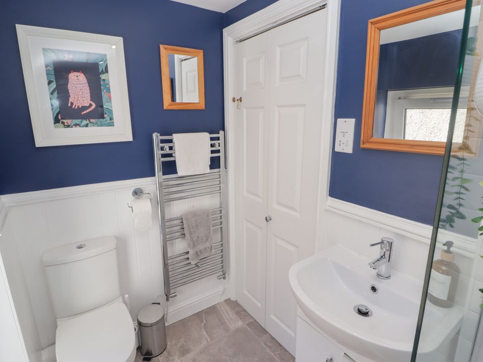 A bathroom with a toilet and sink at 18 Kent Street in Cardiff