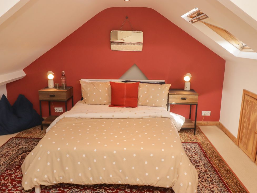 A bedroom with a bed and bedside tables at 18 Kent Street in Cardiff