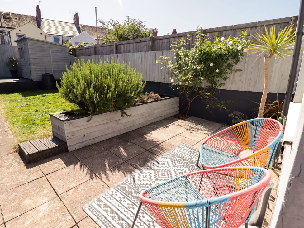 A garden with chairs and planter at 18 Kent Street Cardiff