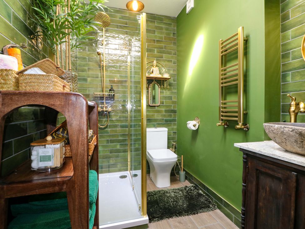 A bathroom with shower and toilet at Shell Cottage in Bournemouth