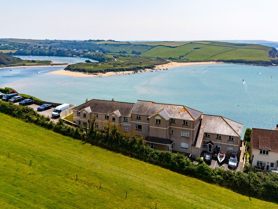 An aerial view of houses near a beach and water at 6 Avon Quillet Bigbury-On-Sea