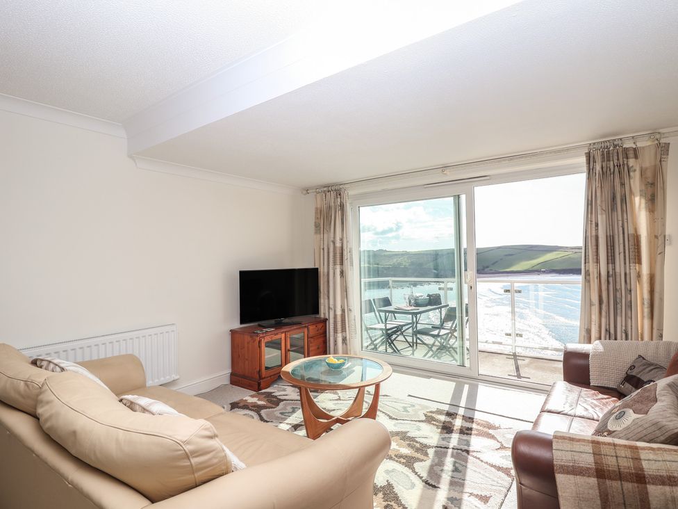 A living room with a sofa and television at 6 Avon Quillet in Bigbury-On-Sea