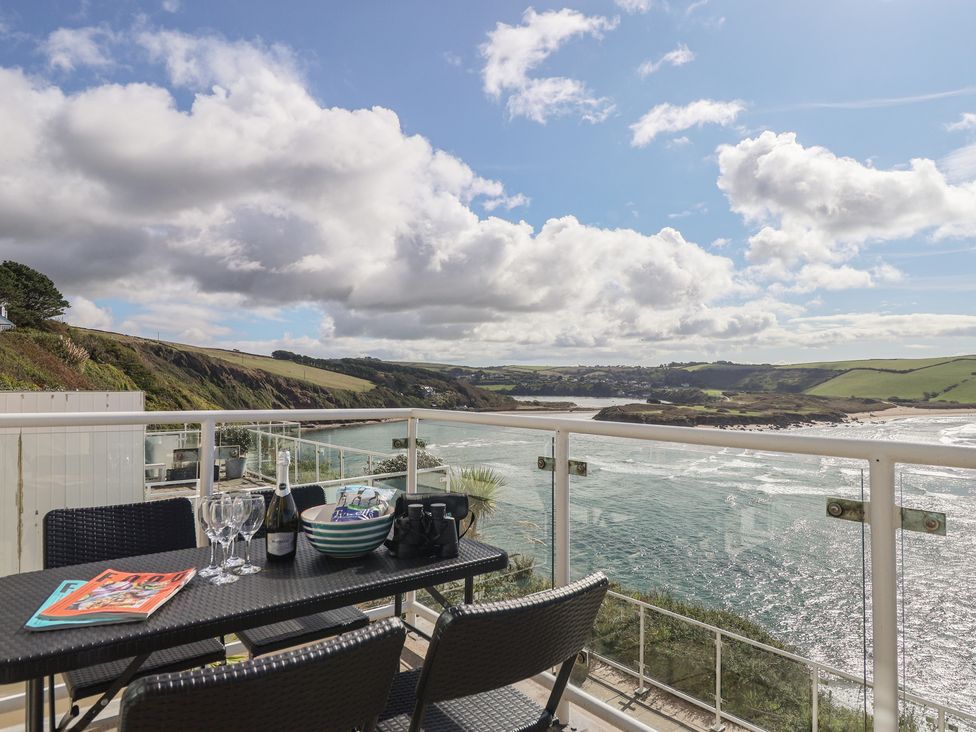 An outdoor terrace with a table and chairs at 6 Avon Quillet Bigbury-On-Sea