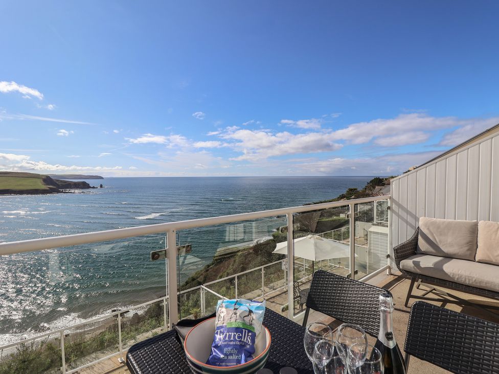 An outdoor area with a view of the ocean and seating at 6 Avon Quillet Bigbury-On-Sea