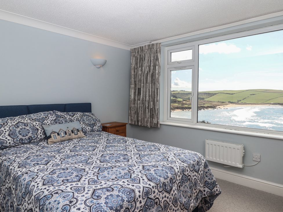 A bedroom with a bed and a view at 6 Avon Quillet, Bigbury-On-Sea