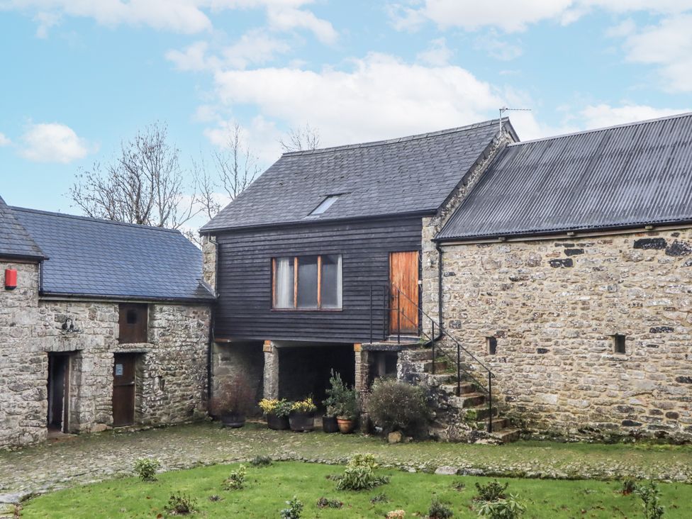 A building with stone walls and stairs at Swallows Nest Widecombe-in-the-Moor near Postbridge