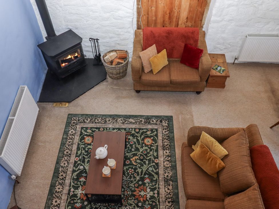 A living room with a sofa and coffee table at Swallows Nest near Widecombe-in-the-Moor