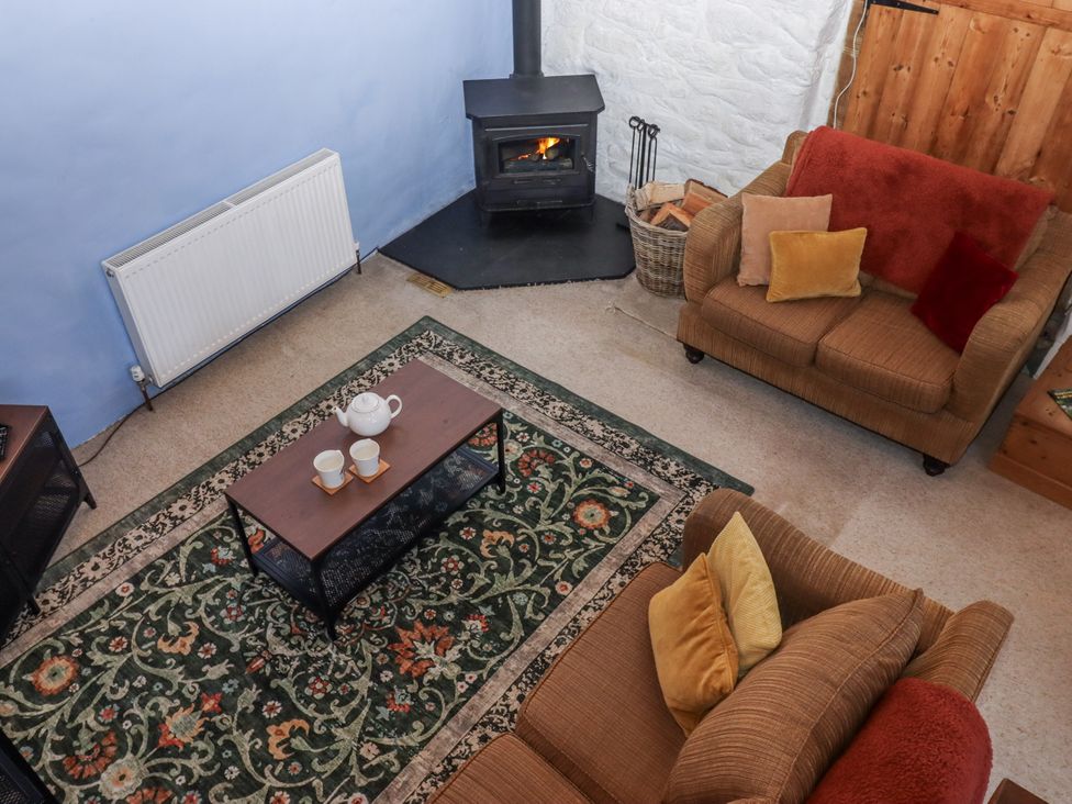 A living room with a coffee table and sofa at Swallows Nest in Widecombe-in-the-Moor near Postbridge