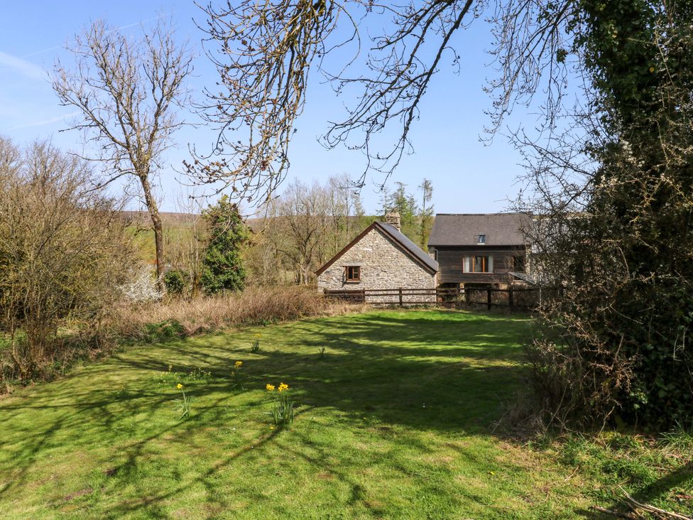 An outdoor view of a property with a garden and buildings at Swallows Nest Widecombe-in-the-Moor near Postbridge