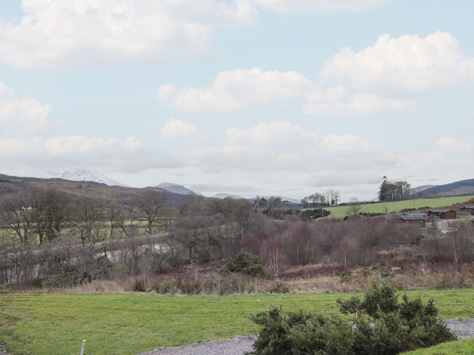A landscape view with fields and trees at Coll in Fort William