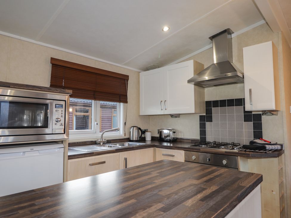 A kitchen with appliances and countertops at Coll in Fort William