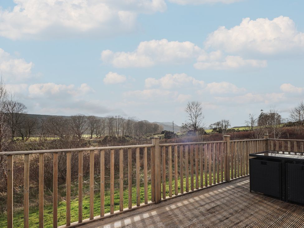 An outdoor area with decking and railing at Monach 3 in Fort William