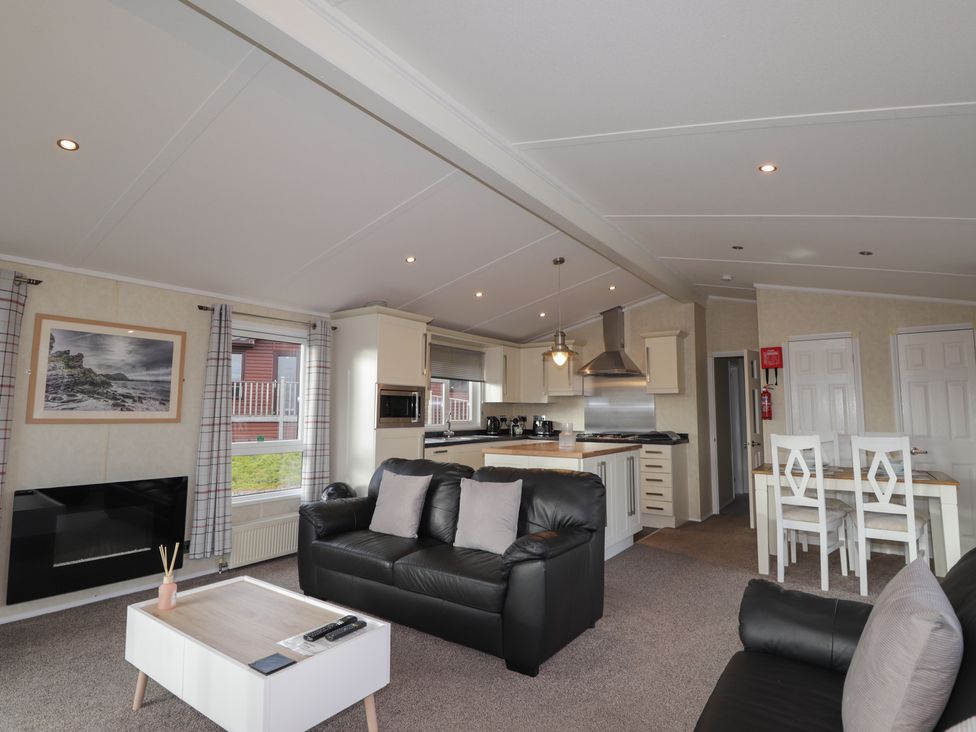 A living room with a sofa and coffee table at Monach 3 in Fort William