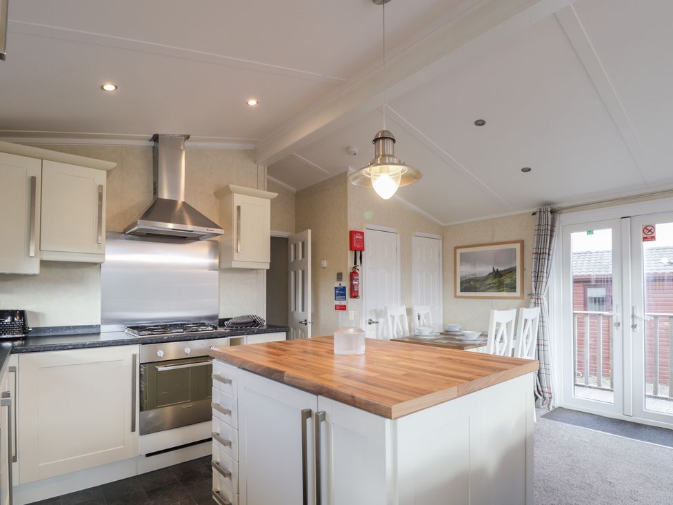 A kitchen with a stove and cabinets at Monach 3 Fort William