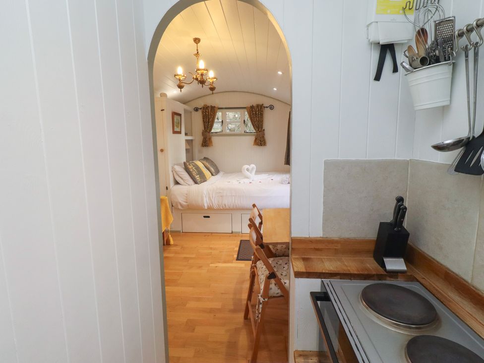 A kitchen area leading to a bedroom at Woodland in Hexham