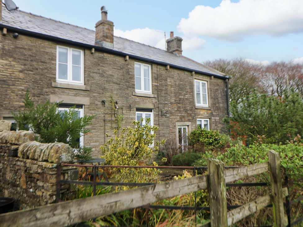 A house with windows and garden at The Farmhouse in High Peak