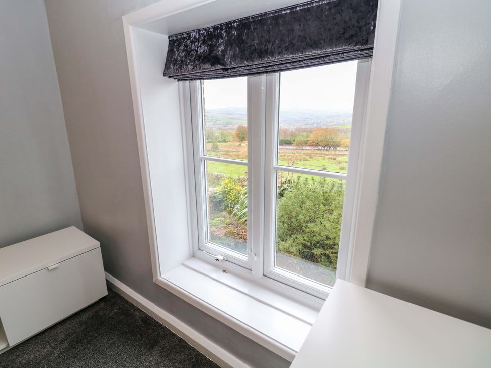 A window with a view in a bedroom at The Farmhouse in High Peak