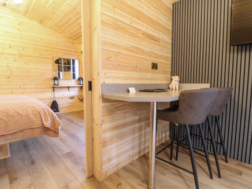 A bedroom with a bed and table in The Sty Derby