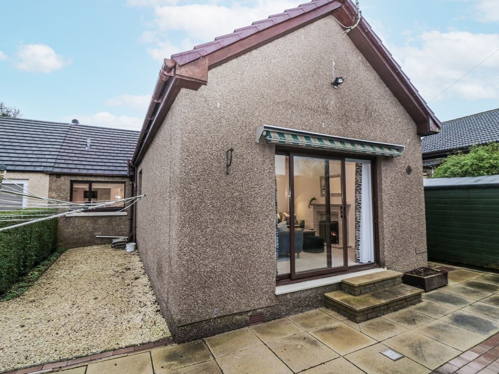 A house exterior with a patio and garden at Cairndhu in Bossiney