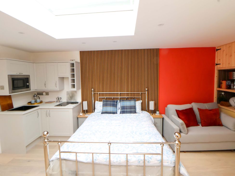 A studio apartment with a bed and a sofa at Skylights in Chester
