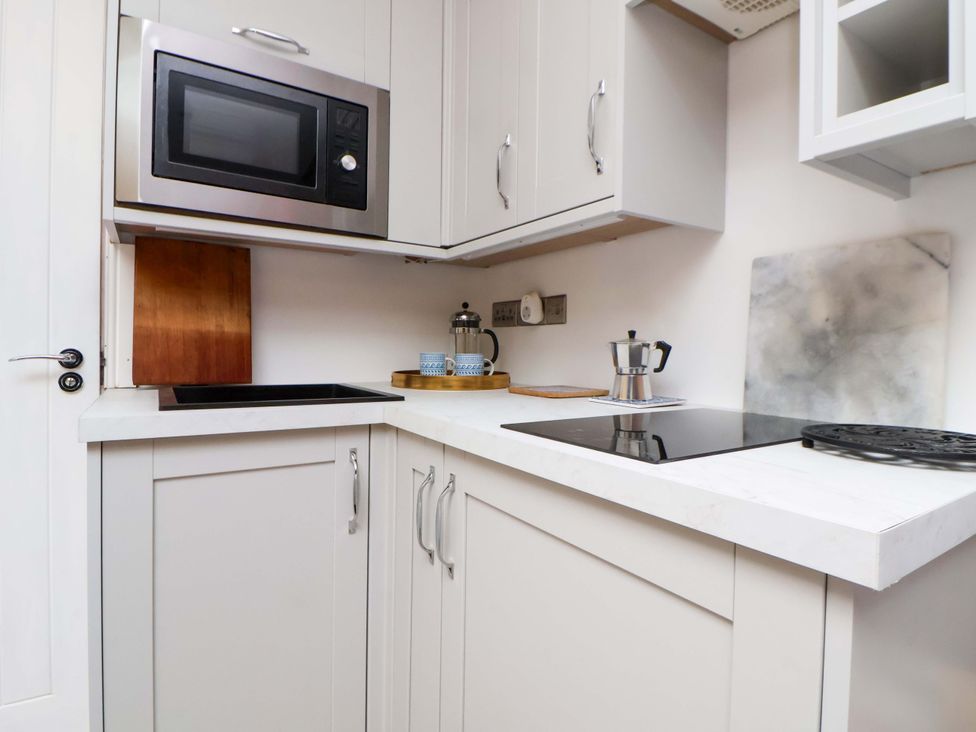 A kitchen with a microwave and coffee maker at Skylights in Chester