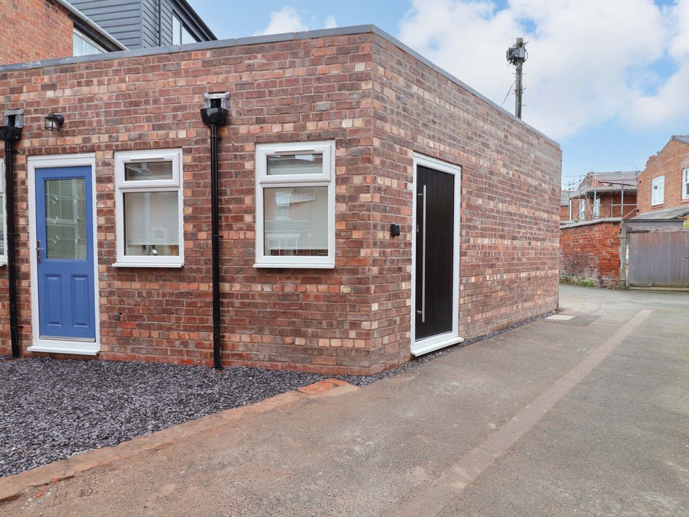 Exterior view showing brick walls and doors at Skylights in Hoole