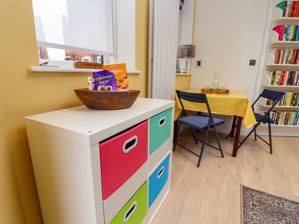 A dining room with a table and chairs at Skylights in Hoole