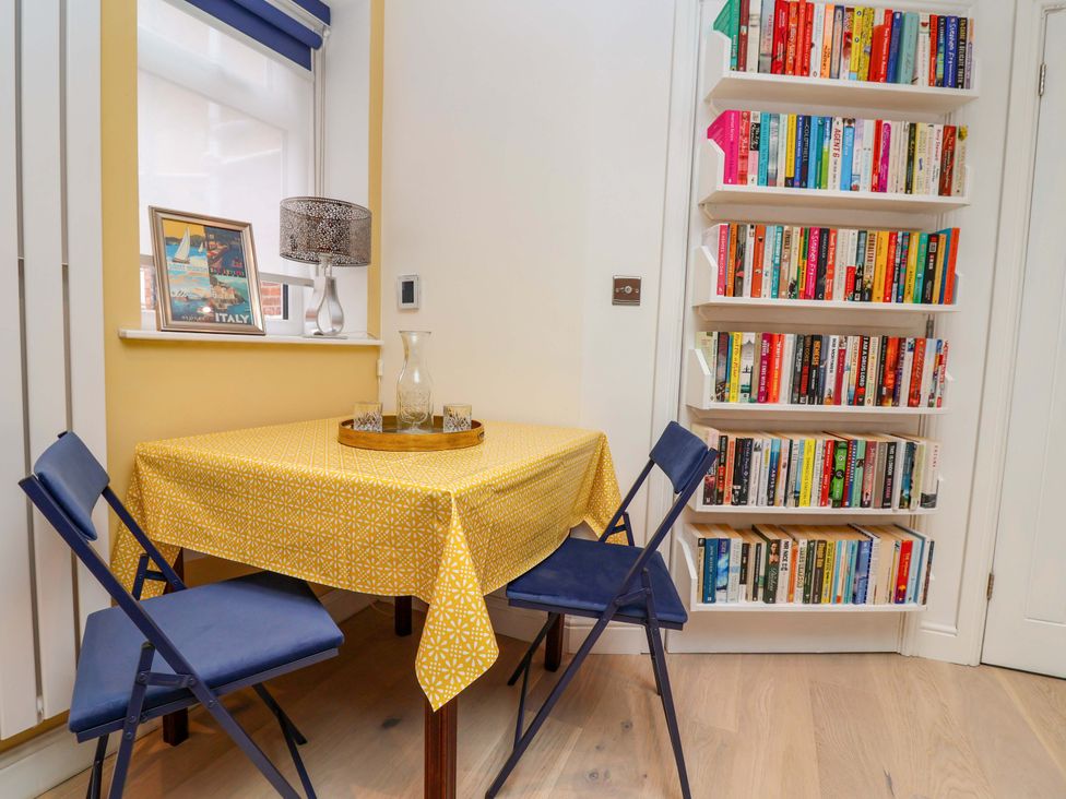 A dining room with a table and chairs at Skylights in Hoole