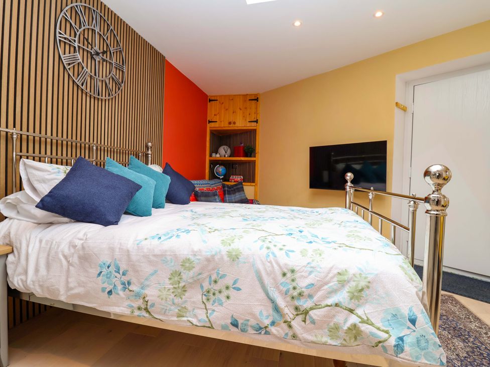 A bedroom with a bed and television at Skylights in Hoole