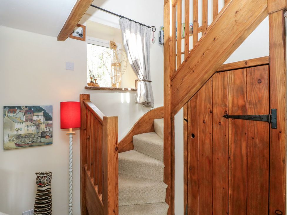 A staircase with wooden elements at 1 Mill Farm Cottages in Narberth