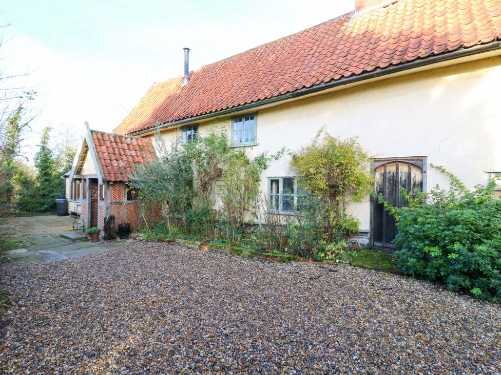 A house with gravel pathway and plants at Town Farm in 