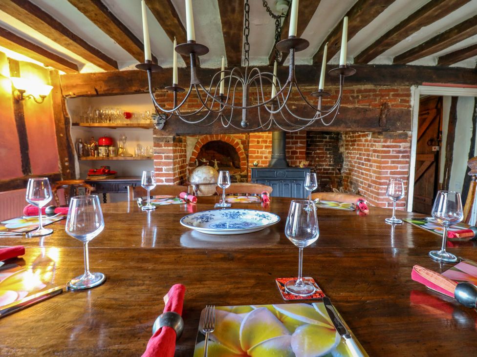A dining room with a large table set for a meal at Town Farm