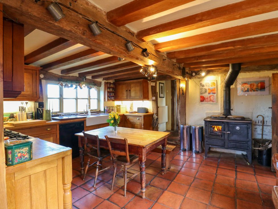 A kitchen with a table and chairs at Town Farm
