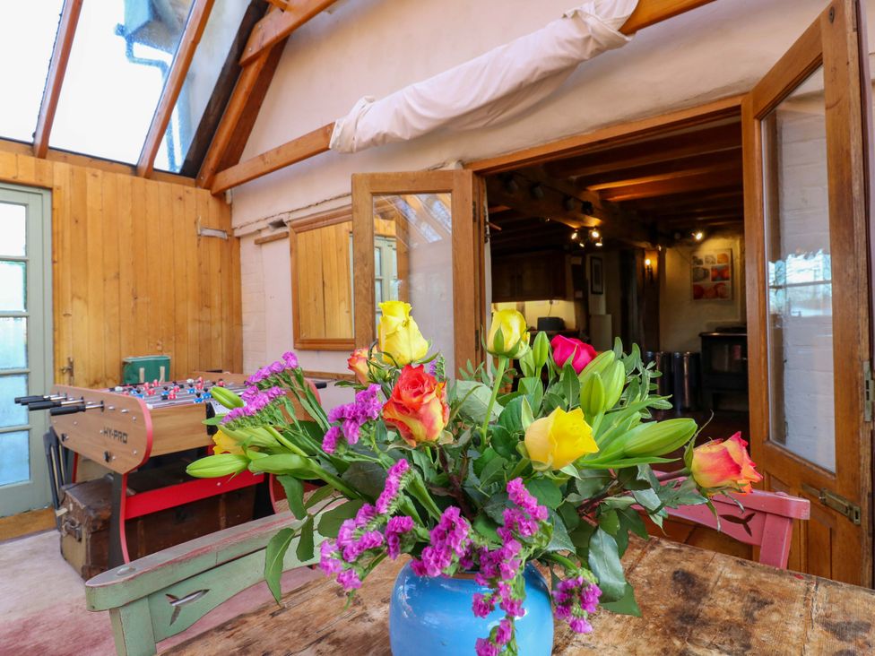 A snug area with a table and foosball table at Town Farm in 