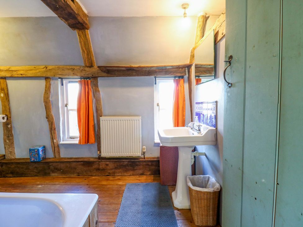 A bathroom with a bathtub and sink at Town Farm