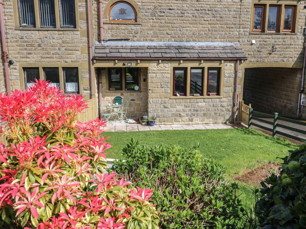 A building exterior with plants and seating area at Underview in Jackson Bridge