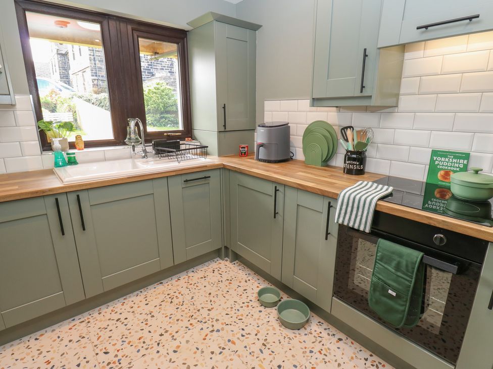 A kitchen with wooden countertop and cooking utensils at Underview in Jackson Bridge