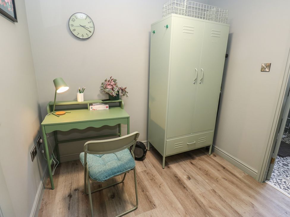 An office with a desk, chair, lamp, and wardrobe at Underview in Jackson Bridge