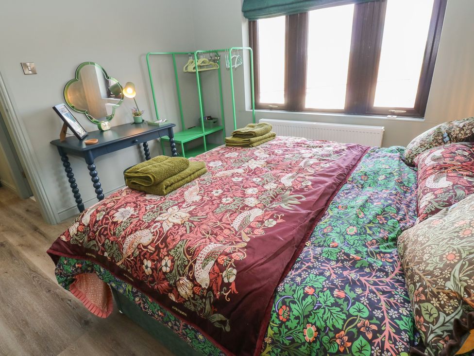 A bedroom with a bed and wardrobe at Underview in Jackson Bridge