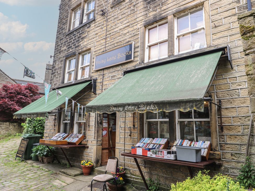 A bookshop with tables displaying books at Daisy Lane Books in Jackson Bridge