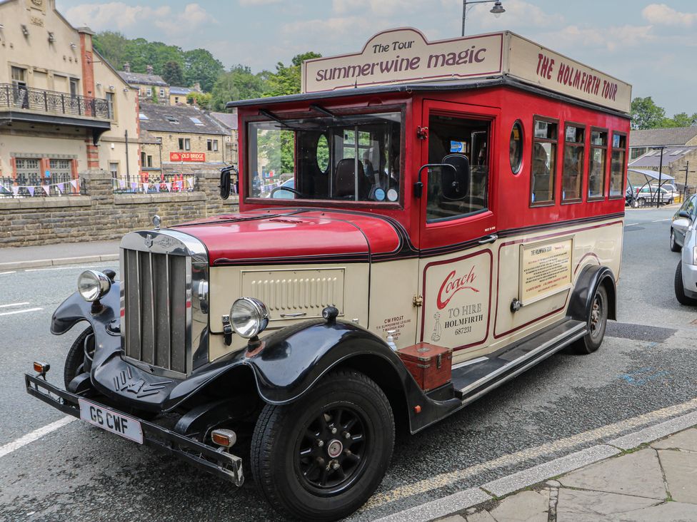 A vintage tour bus parked on the street at Underview in Jackson Bridge