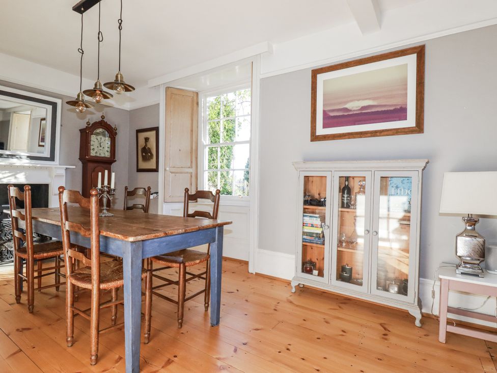 A dining room with a table and chairs at Rosedale in St. Ives