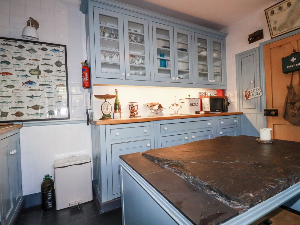 A kitchen with cabinets and countertop at Rosedale in St. Ives