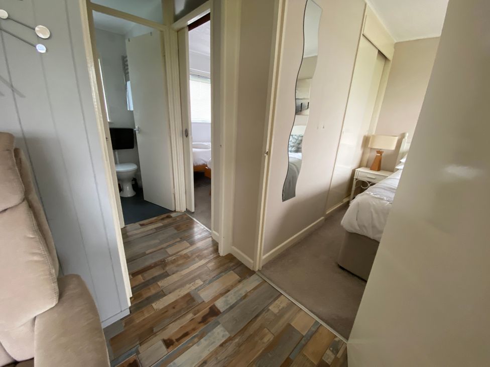 A hallway with access to a bedroom and bathroom at 300 California Sands, California, Norfolk