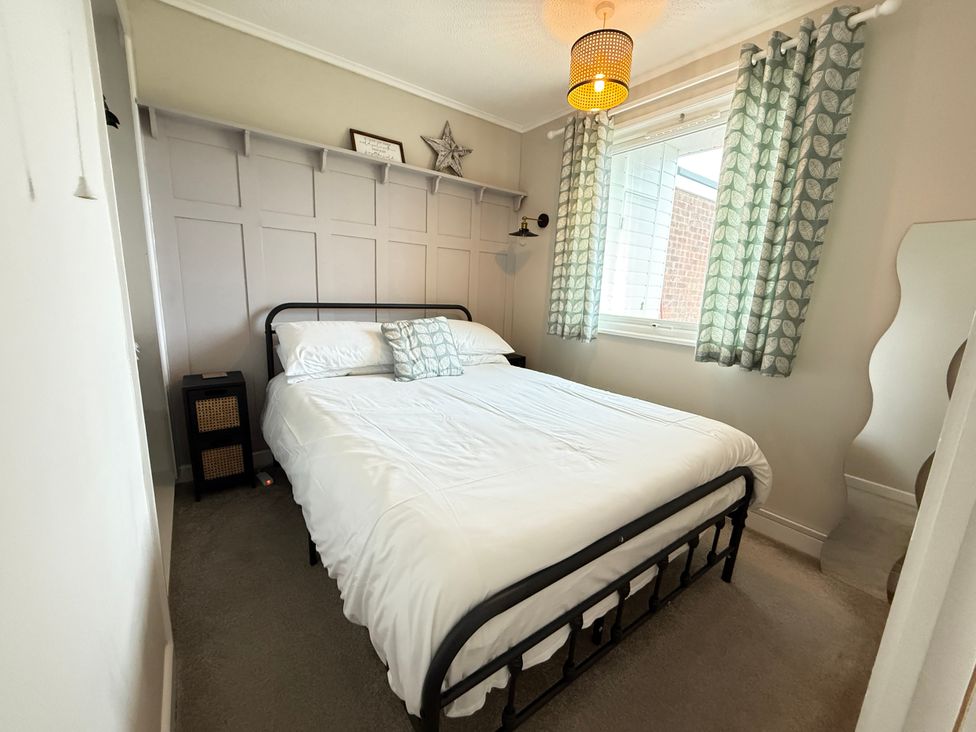 A bedroom with a bed and window at 300 California Sands, California, Norfolk